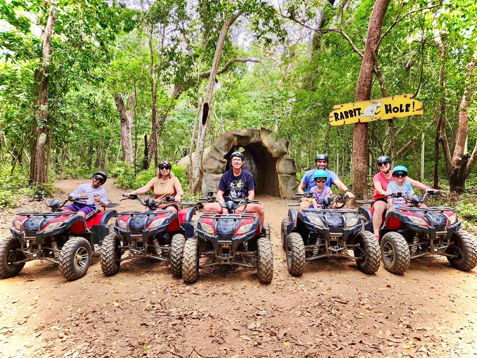 Group ready for an ATV adventure through Roatán's jungle